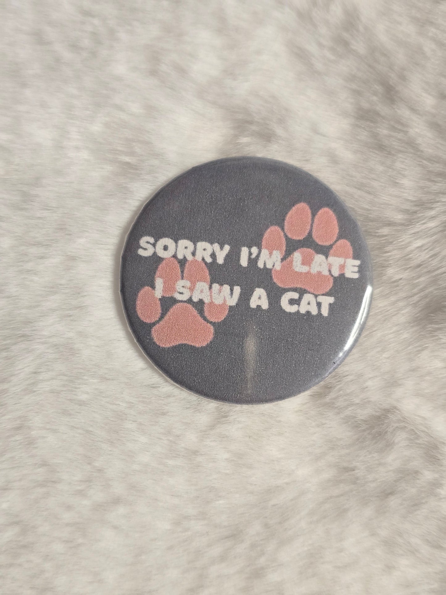 I saw a cat 1.25 inch buttons